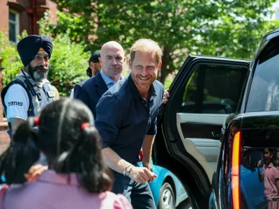 Britain's Prince Harry greets a child as he leaves the Birmingham Children's Hospital after celebrating the 20th anniversary of the first WellChild Nurse programme, in Birmingham, Britain, July 9, 2026. REUTERS/Isabel Infantes    TPX IMAGES OF THE DAY