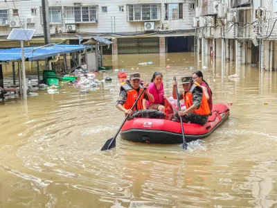 Paramilitary police officers evacuate residents in a rubber dinghy through a flooded area after rainfall brought by typhoon Maysak, in Nanning, Guangxi Zhuang Autonomous Region, China July 6, 2026. cnsphoto via REUTERS  ATTENTION EDITORS - THIS IMAGE WAS PROVIDED BY A THIRD PARTY. CHINA OUT.