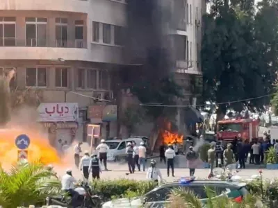 Smoke and fire rise at the site where explosive devices blew up near a hotel where French President Emmanuel Macron was meant to be staying, in Damascus, Syria, in this screengrab obtained from a video, July 7, 2026. REUTERS/Yamam Al Shaar