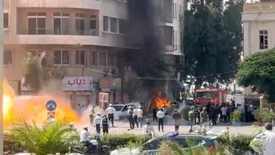 Smoke and fire rise at the site where explosive devices blew up near a hotel where French President Emmanuel Macron was meant to be staying, in Damascus, Syria, in this screengrab obtained from a video, July 7, 2026. REUTERS/Yamam Al Shaar
