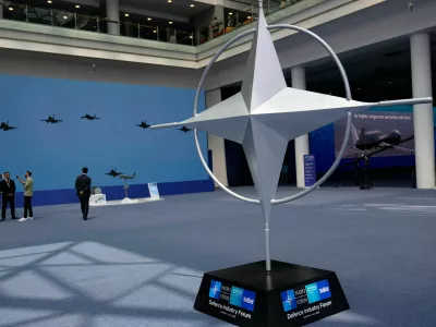 Participants view displays during the NATO Defense Industry Forum at the NATO summit in Ankara, Turkey, Tuesday, July 7, 2026. (AP Photo/Hussein Malla)