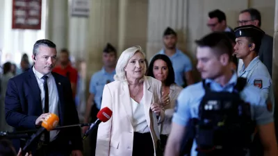 French far-right leader Marine Le Pen, member of parliament for the Rassemblement National (National Rally - RN) party, leaves after the verdict in her appeal trial, alongside the RN party itself and 10 others defendants found guilty of diverting European Parliament funds, at the Paris courthouse on the Ile de la Cite, in Paris, France, July 7, 2026. REUTERS/Benoit Tessier