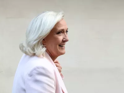 French far-right leader Marine Le Pen, member of parliament for the Rassemblement National (National Rally - RN) party, leaves after a party meeting at the Rassemblement National headquarters following the verdict in her appeal trial, alongside the RN party itself and 10 others defendants found guilty of diverting European Parliament funds, in Paris, France, July 7, 2026. REUTERS/Stephane Mahe    TPX IMAGES OF THE DAY