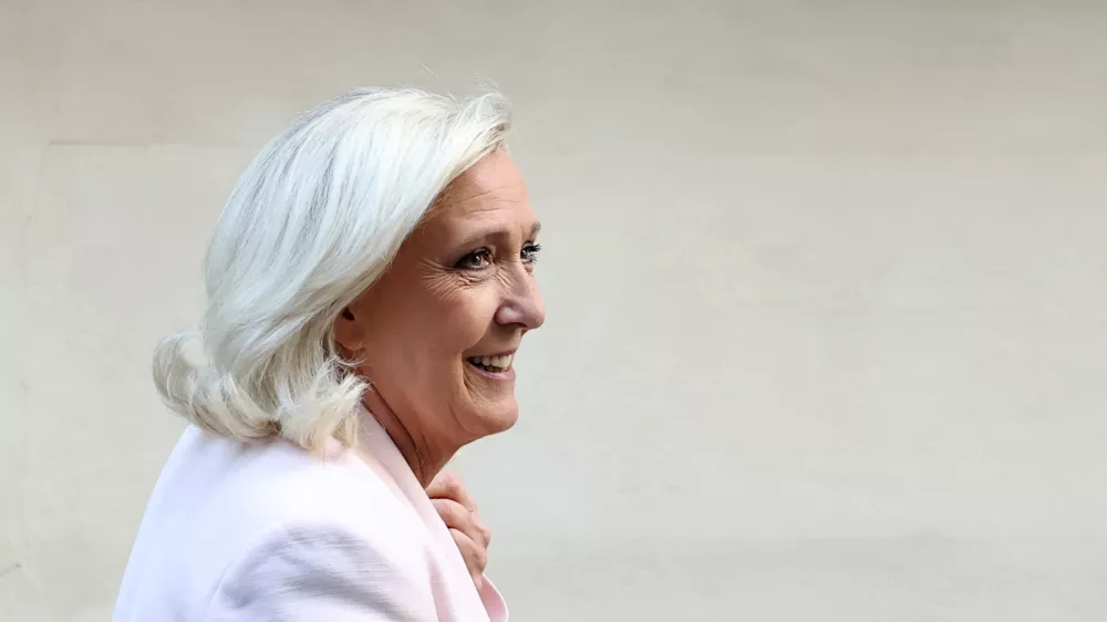 French far-right leader Marine Le Pen, member of parliament for the Rassemblement National (National Rally - RN) party, leaves after a party meeting at the Rassemblement National headquarters following the verdict in her appeal trial, alongside the RN party itself and 10 others defendants found guilty of diverting European Parliament funds, in Paris, France, July 7, 2026. REUTERS/Stephane Mahe    TPX IMAGES OF THE DAY