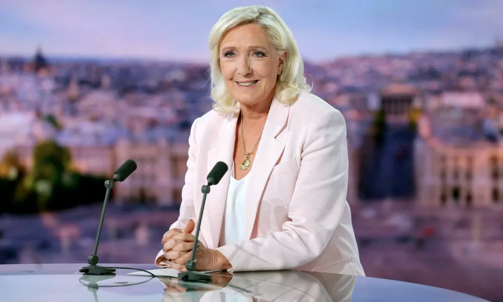 FILE PHOTO: French far-right leader Marine Le Pen, member of parliament for the Rassemblement National (National Rally - RN) party, poses prior to an interview on the evening news broadcast of French TV channel TF1, following the verdict in her appeal trial over misuse of EU funds, in Boulogne-Billancourt, near Paris, France, July 7, 2026. REUTERS/Christian Hartmann/Pool   TPX IMAGES OF THE DAY/File Photo