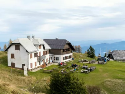Urslja Peak / Slovenia - October 10 2020: Mountain hut on Urslja gora or Plesivec in the Koroska region of Slovenia on a summer day.