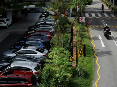 FILE PHOTO: Cars for sale are parked at used car dealerships in Singapore October 17, 2022. REUTERS/Edgar Su/File Photo