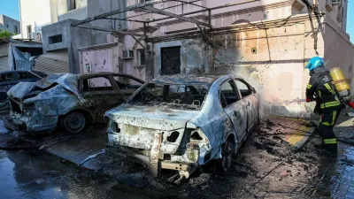A firefighter works in the aftermath of Iranian drone attacks, according to Bahrain's Interior Ministry, at a location given as Bahrain, in this handout image released on June 11, 2026. Ministry of Interior of the Kingdom of Bahrain/Handout via REUTERS  THIS IMAGE HAS BEEN SUPPLIED BY A THIRD PARTY. VERIFICATION: Location or date not verified. No older version found posted online before June 11. Ministry of Interior of the Kingdom of Bahrain said on X on June 11 that houses and vehicles were damaged due to the falling debris from drone interception.
