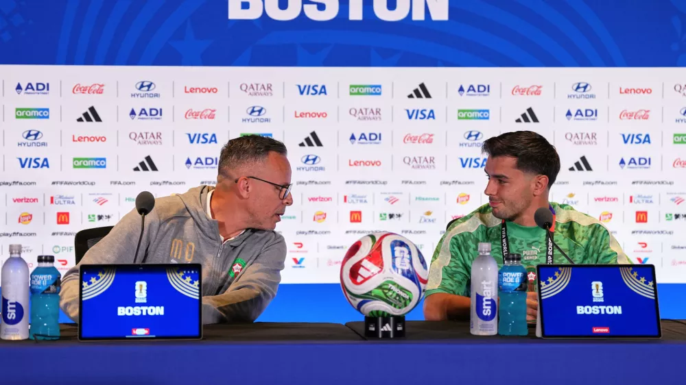 Morocco head coach Mohamed Ouahbi and Morocco's Brahim Diaz (10) talk to the media during a press conference ahead of the World Cup quarterfinal soccer match between France and Morocco in Foxborough, Mass., near Boston, Wednesday, July 8, 2026. (AP Photo/Martin Meissner)