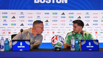 Morocco head coach Mohamed Ouahbi and Morocco's Brahim Diaz (10) talk to the media during a press conference ahead of the World Cup quarterfinal soccer match between France and Morocco in Foxborough, Mass., near Boston, Wednesday, July 8, 2026. (AP Photo/Martin Meissner)
