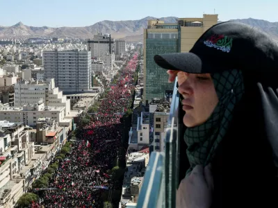 A woman looks on, as mourners gather on the day of the burial of Iran's late Supreme Leader Ayatollah Ali Khamenei, who was killed on February 28 in Israeli and U.S. airstrikes, in Mashhad, Iran, July 9, 2026. REUTERS/Mohammed Salem Foreign media in Iran operate under guidelines set by the Ministry of Culture and Islamic Guidance, which regulates press activity and permissions.  ISRAEL OUT. NO COMMERCIAL OR EDITORIAL SALES IN ISRAEL. NO ACCESS FOR ISRAELI MEDIA. NO USE BBC PERSIAN. NO USE VOA PERSIAN. NO USE MANOTO. NO USE IRAN INTERNATIONAL. NO USE RADIO FARDA. DIGITAL: NO USE BBC PERSIAN. NO USE VOA PERSIAN. NO USE MANOTO. NO USE IRAN INTERNATIONAL. NO USE RADIO FARDA.   TPX IMAGES OF THE DAY