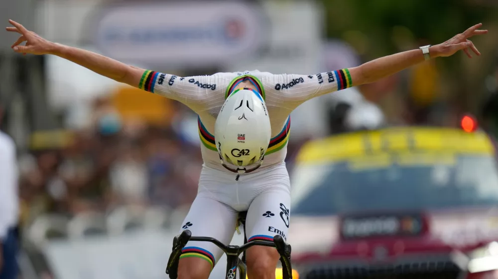 Slovenia's Tadej Pogacar celebrates as he crosses the finish line to win the sixth stage of the Tour de France cycling race with start in Pau and finish in Gavarnie-Gedre, France, Thursday, July 9, 2026. (AP Photo/Mosa'ab Elshamy)