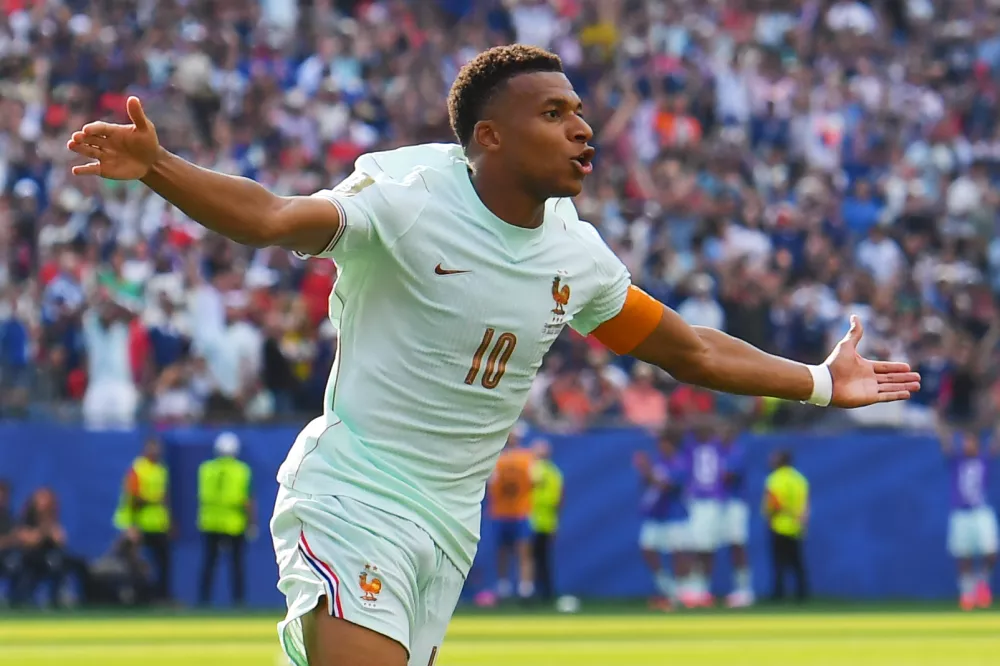 France's Kylian Mbappe (10) celebrates scoring the opening goal during the World Cup quarterfinal soccer match between France and Morocco in Foxborough, Mass., near Boston, Thursday, July 9, 2026. (AP Photo/Steven Senne)