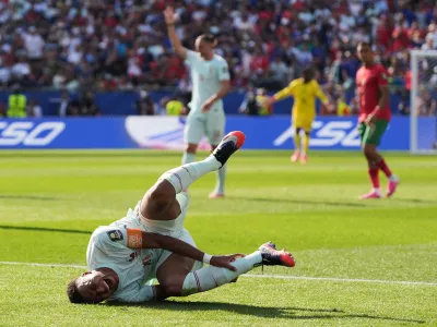 France's Kylian Mbappe (10) reacts to being tripped during the World Cup quarterfinal soccer match between France and Morocco in Foxborough, Mass., near Boston, Thursday, July 9, 2026. (AP Photo/Stephanie Scarbrough)