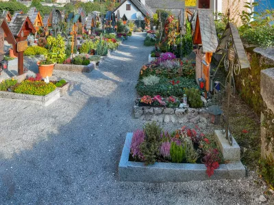 Stunning view of famous Hallstatt mountain village with Hallstatter lake. Old cemetery. Location: Hallstatt, Salzkammergut region, Austria, Alps. Europe.
