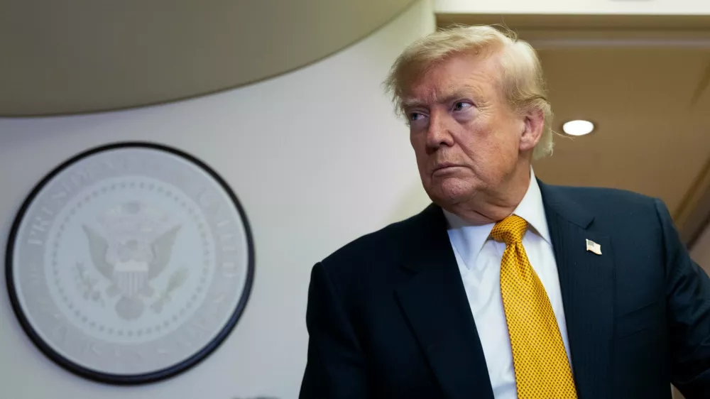 President Donald Trump speaks with reporters in flight on Air Force One after landing at U.S. Air Force Base at RAF Mildenhall, in Suffolk, Eastern England, Wednesday, July 8, 2026. (AP Photo/Alex Brandon)