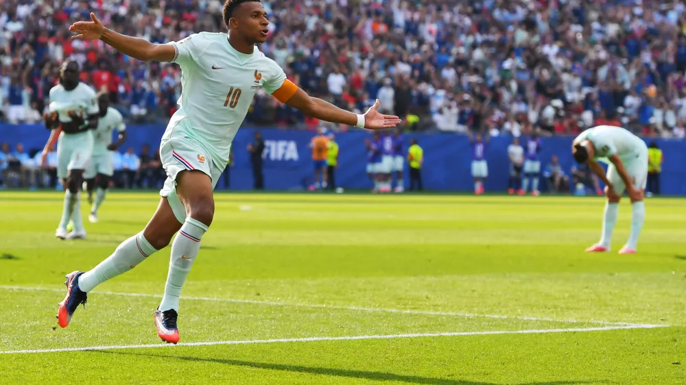 France's Kylian Mbappe (10) celebrates scoring the opening goal during the World Cup quarterfinal soccer match between France and Morocco in Foxborough, Mass., near Boston, Thursday, July 9, 2026. (AP Photo/Steven Senne)