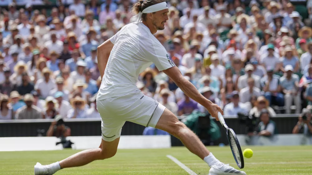 Alexander Zverev of Germany stretches as he plays a return to Arthur Fery of Britain during their men's singles semifinal match at the Wimbledon Tennis Championships in London, Friday, July 10, 2026. (AP Photo/Kirsty Wigglesworth)