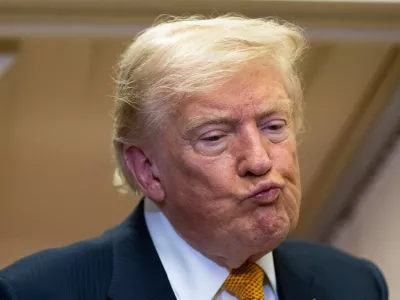 President Donald Trump listens to a question as he speaks with reporters in flight on Air Force One after landing at U.S. Air Force Base at RAF Mildenhall, in Suffolk, Eastern England, Wednesday, July 8, 2026. (AP Photo/Alex Brandon)