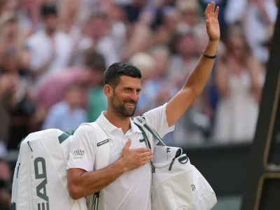 Novak Djokovic of Serbia leaves after losing to Jannik Sinner of Italy in their men's singles semifinal match at the Wimbledon Tennis Championships in London, Friday, July 10, 2026. (AP Photo/Kin Cheung)