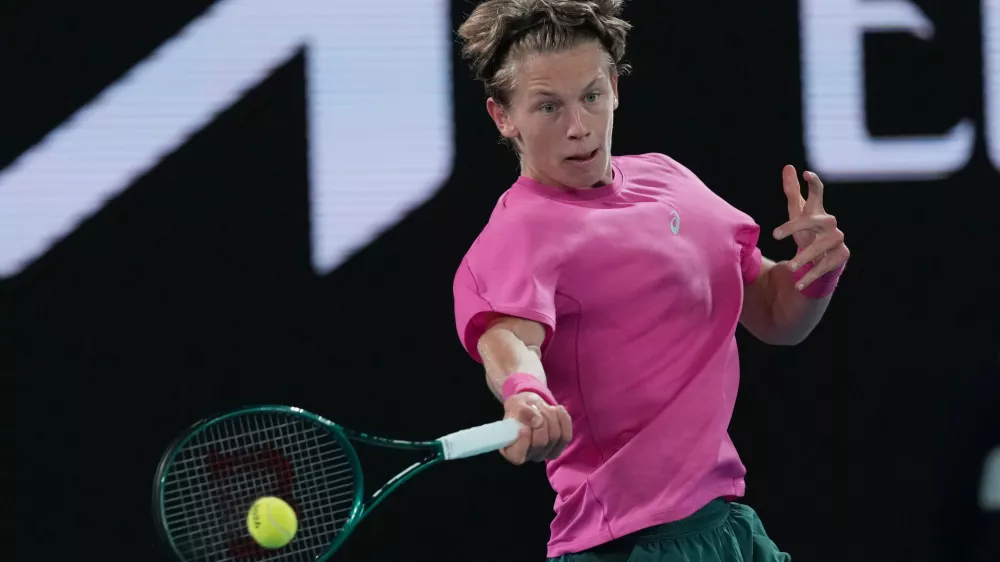 Ziga Sesko of Slovenia plays a forehand return to Keaton Hance of the U.S. during the boy's singles final at the Australian Open tennis championship in Melbourne, Australia, Sunday, Feb. 1, 2026. (AP Photo/Dar Yasin)