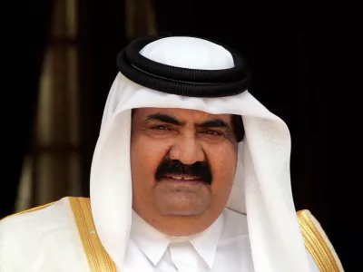 FILE PHOTO: The emir of Qatar, Sheikh Hamad bin Khalifa al-Thani, looks on before his meeting with Indian Prime Minster Manmohan Singh (not in picture) in New Delhi, India April 14, 2005. REUTERS/B Mathur/File Photo