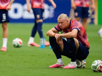 Norway's Erling Haaland sits on a ball during warmup before the World Cup quarterfinal soccer match between Norway and England in Miami Gardens, Fla., Saturday, July 11, 2026. (AP Photo/Rebecca Blackwell)