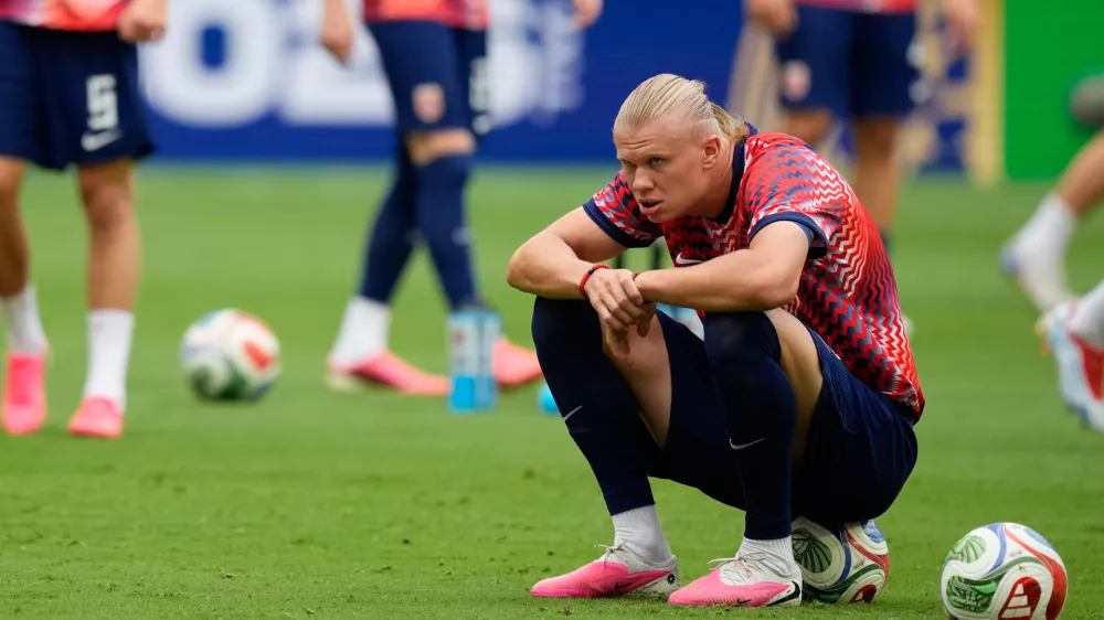 Norway's Erling Haaland sits on a ball during warmup before the World Cup quarterfinal soccer match between Norway and England in Miami Gardens, Fla., Saturday, July 11, 2026. (AP Photo/Rebecca Blackwell)