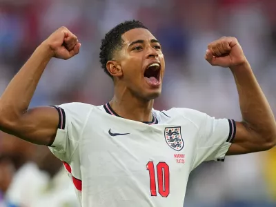 Jude Bellingham celebrates England's victory over Norway in a World Cup quarterfinal soccer match in Miami Gardens, Fla., Saturday, July 11, 2026. (AP Photo/Julio Cortez)