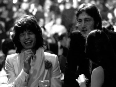CENTURY CITY, CA - MARCH 13: Mick Jagger, John Lennon and May Pang attend Second Annual American Film Institute Lifetime Achievement Awards Honoring James Cagney on March 13, 1974 at the Century Plaza Hotel in Century City, California. (Photo by Ron Galella/Ron Galella Collection via Getty Images)
