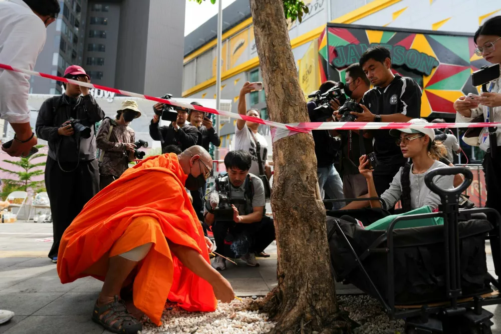 A Buddhist monk prays at the site of a deadly fire at a pub in Bangkok, Thailand, July 13, 2026. REUTERS/Arnun Chonmahatrakool