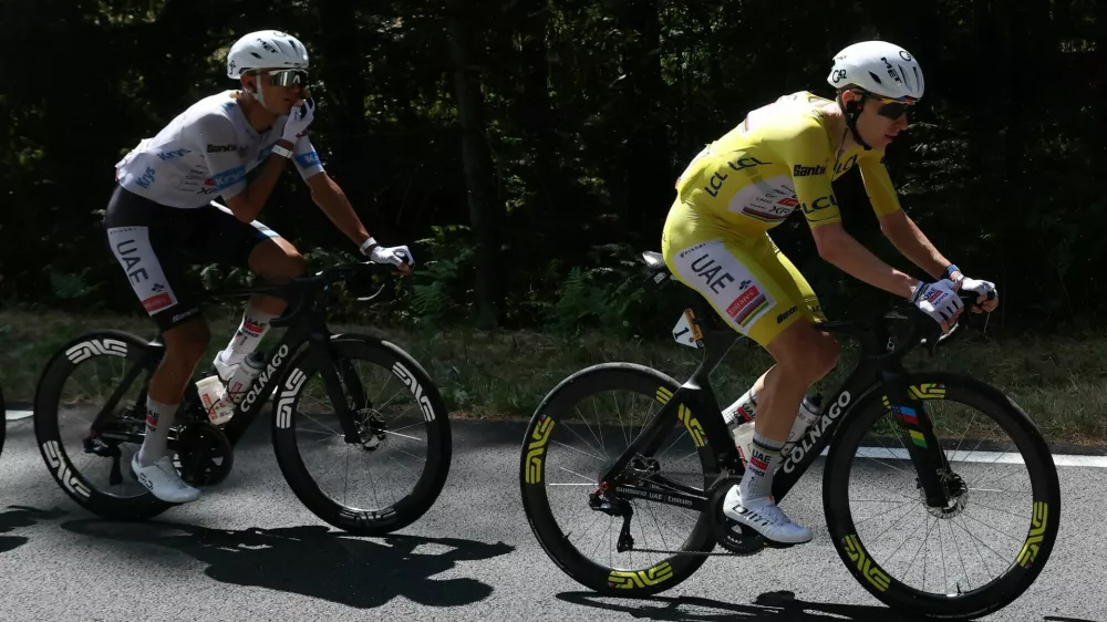 Cycling - Tour de France - Stage 9 - Malemort to Ussel - Malemort, France - July 12, 2026 UAE Team Emirates - XRG's Tadej Pogacar wearing the yellow jersey and UAE Team Emirates - XRG's Isaac Del Toro wearing the white jersey in action during stage 9 REUTERS/Gonzalo Fuentes