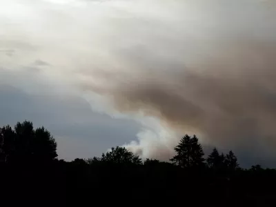 Smoke rises from a wildfire, as French firefighters battle the blaze in the Fontainebleau forest in in Noisy-sur-Ecole near Paris, amid a heatwave affecting a large part of the country, France, July 13, 2026. REUTERS/Benoit Tessier