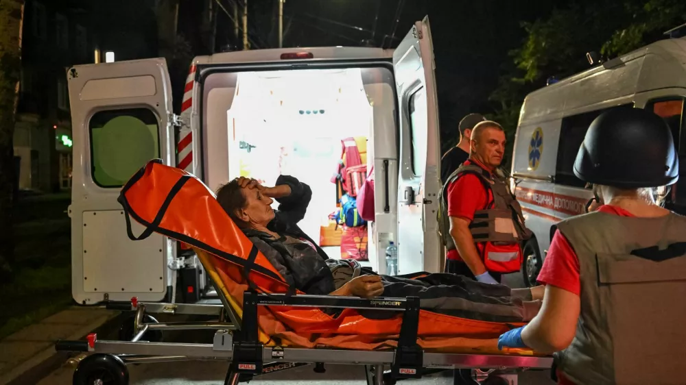 Medical workers evacuate a person from an apartment building hit of a Russian drone strike, amid Russia's attack on Ukraine, in Zaporizhzhia, Ukraine July 12, 2026. REUTERS/Stringer