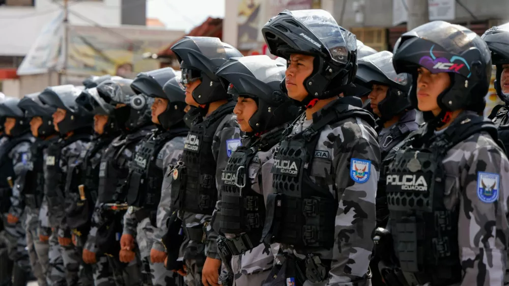 Police officers stand in formation outside El Inca prison after a security operation due to riots, following the disappearance of Jose Adolfo Macias, alias 'Fito', leader of the Los Choneros criminal group, in Quito, Ecuador, January 8, 2024. REUTERS/Karen Toro