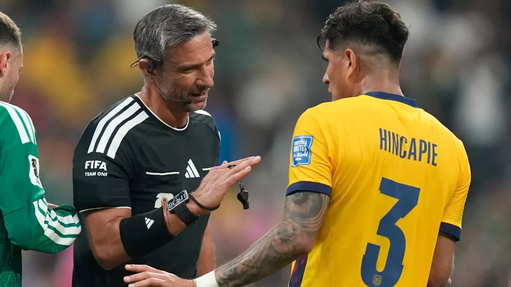 Referee Slavko Vincic, of Slovenia, talks to Ecuador's Piero Hincapie (3) during the World Cup round of 32 soccer match between Mexico and Ecuador in Mexico City, Tuesday, June 30, 2026. (AP Photo/Fernando Llano)