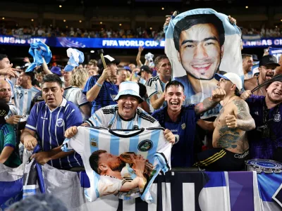 Soccer Football - FIFA World Cup 2026 - Quarter Final - Argentina v Switzerland - Kansas City Stadium, Kansas City, Missouri, U.S. - July 11, 2026 Argentina fans celebrate after the match as Argentina qualify for the semi final of the World Cup REUTERS/Amanda Perobelli