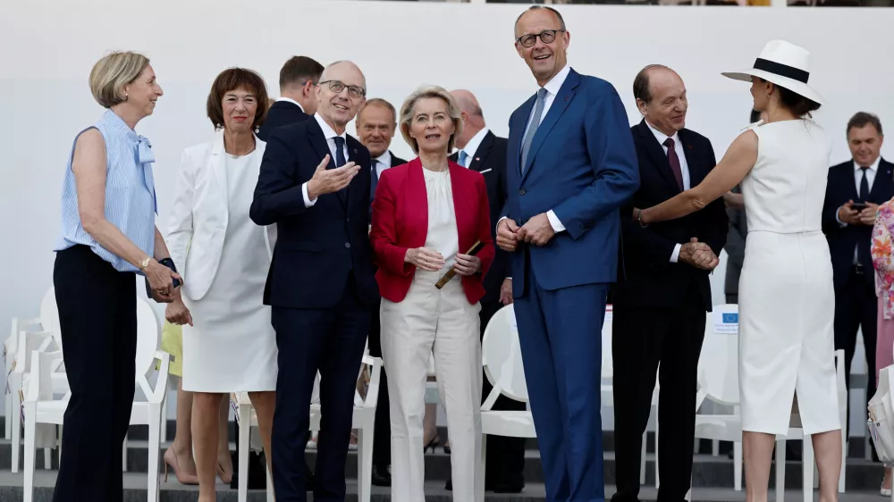 European Commission President Ursula von der Leyen, Luxembourg's Prime Minister Luc Frieden, centre left, and German Chancellor Friedrich Merz, centre right, attend the annual Bastille Day military parade in Paris, France, Tuesday, July 14, 2026. (Benoit Tessier/Pool Photo via AP)