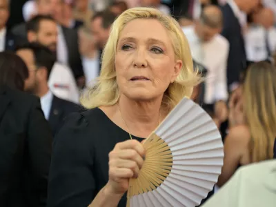 Far-right leader Marine Le Pen arrivess to attend the 10th anniversary of the deadly 2016 truck attack in Nice, southern France, Tuesday, July 14, 2026. (AP Photo/Philippe Magoni, Pool)