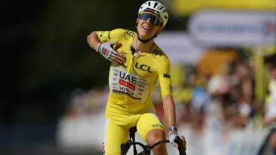 Cycling - Tour de France - Stage 10 - Aurillac to Le Lioran - Le Lioran, France - July 14, 2026 UAE Team Emirates - XRG's Tadej Pogacar wearing the yellow jersey celebrates winning stage 10 REUTERS/Gonzalo Fuentes