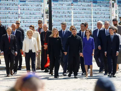 Ukraine's President Volodymyr Zelenskiy and his wife Olena, Prime Minister Yulia Svyrydenko, European Commission President Ursula von der Leyen, Moldova's President Maia Sandu, Romania's President Nicusor Dan, Croatian Prime Minister Andrej Plenkovic, Slovenian Prime Minister Janez Jansa, Albania's President Bajram Begaj, Cardinal Matteo Zuppi arrive to mark the Day of Ukrainian Statehood in front of St. Michael's Cathedral, amid Russia's attack on Ukraine, in Kyiv, Ukraine July 15, 2026. REUTERS/Valentyn Ogirenko