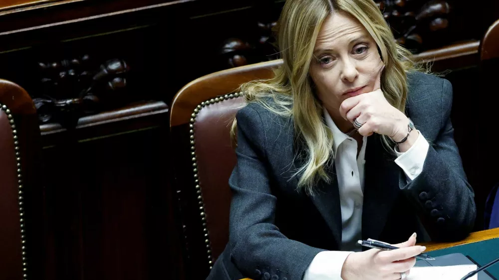 FILE PHOTO: Italy's Prime Minister Giorgia Meloni listens to debate, after she reported on her government's actions and is expected to speak on the latest developments in Iran, at the lower house of Parliament in Rome, Italy, April 9, 2026. REUTERS/Remo Casilli/File Photo