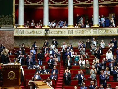 Members of parliament applaud following the result of a vote on the bill establishing a right to medical aid in dying at the National Assembly in Paris, France, July 15, 2026. REUTERS/Abdul Saboor