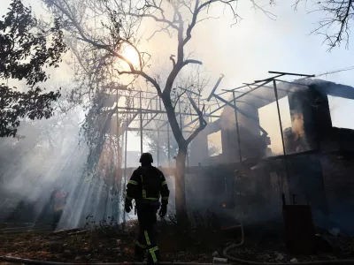 A firefighter puts out a fire after a Russian air guided bomb hit a private house in Zaporizhzhia, Ukraine, Thursday, July 16, 2026. (AP Photo/Kateryna Klochko)
