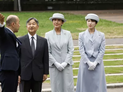 FILE - Japanese Emperor Naruhito, center left, Empress Masako center right, and Princess Aiko, right, listen to Nagasaki Mayor Shiro Suzuki as they visit the cenotaph for the atomic bombing victims at the peace park in Nagasaki. western Japan, Sept. 12, 2025. (Kyodo News via AP, File)