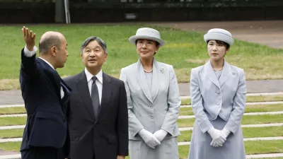 FILE - Japanese Emperor Naruhito, center left, Empress Masako center right, and Princess Aiko, right, listen to Nagasaki Mayor Shiro Suzuki as they visit the cenotaph for the atomic bombing victims at the peace park in Nagasaki. western Japan, Sept. 12, 2025. (Kyodo News via AP, File)