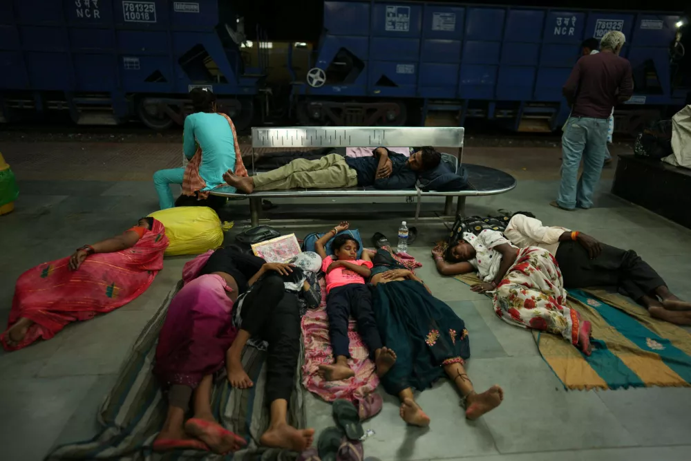 Residents sleep on the platform of a railway station to escape the heat in Banda, northern Indian state of Uttar Pradesh, Saturday, June 20, 2026. (AP Photo/Rajesh Kumar Singh)