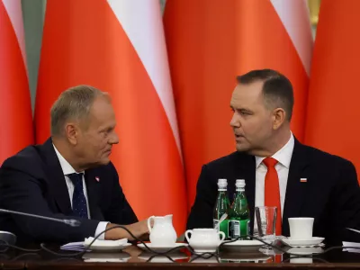 FILE PHOTO: Poland's Prime Minister Donald Tusk speaks to President Karol Nawrocki during a Cabinet Council meeting led by the president at the Presidential Palace in Warsaw, Poland, August 27, 2025. REUTERS/Kacper Pempel/File Photo