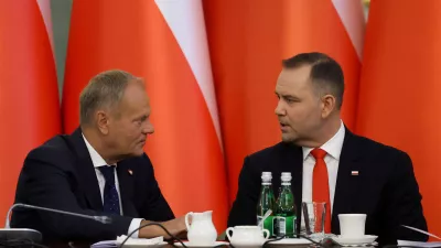 FILE PHOTO: Poland's Prime Minister Donald Tusk speaks to President Karol Nawrocki during a Cabinet Council meeting led by the president at the Presidential Palace in Warsaw, Poland, August 27, 2025. REUTERS/Kacper Pempel/File Photo