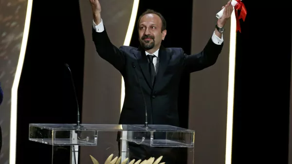 Director Asghar Farhadi, Best screenplay award winner for his film "Forushande" (The Salesman), reacts on stage during the closing ceremony of the 69th Cannes Film Festival in Cannes, France, May 22, 2016.      REUTERS/Eric Gaillard